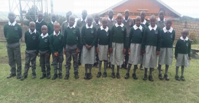 Beat The Drum Village children in their school uniforms